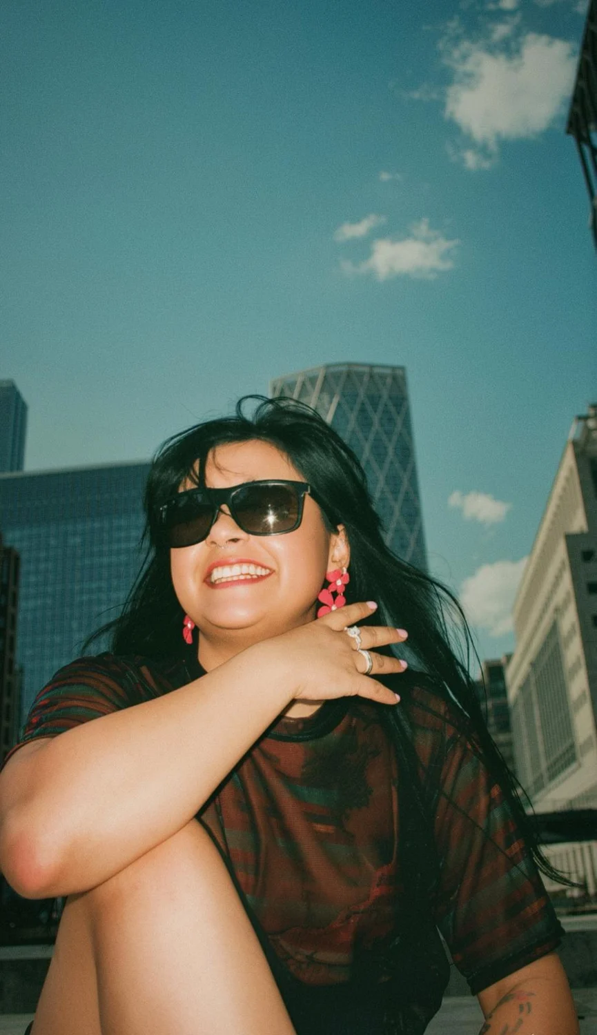 Andreea smiling in the city