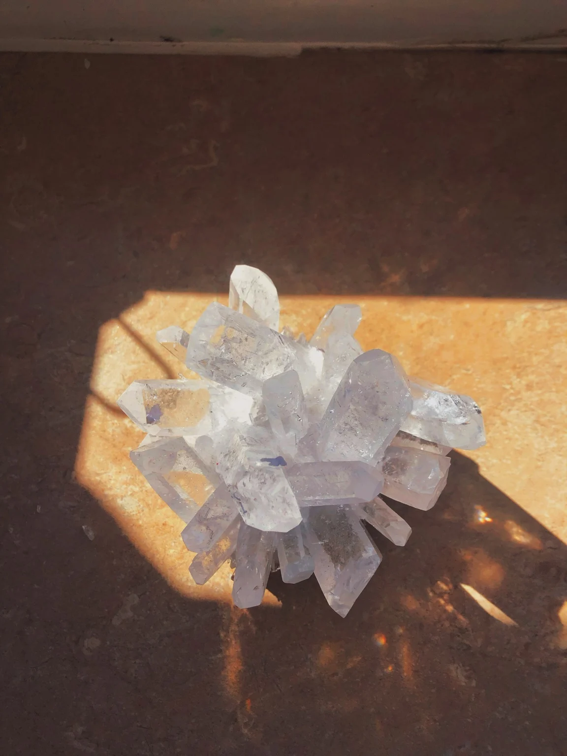 A cluster of pale crystals in sunlight