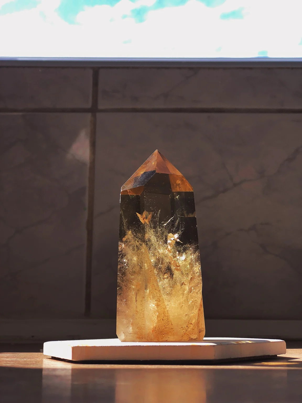 An amber-coloured crystal catching the light